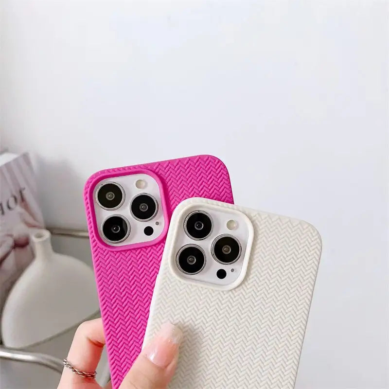 a person holding a pink iphone case