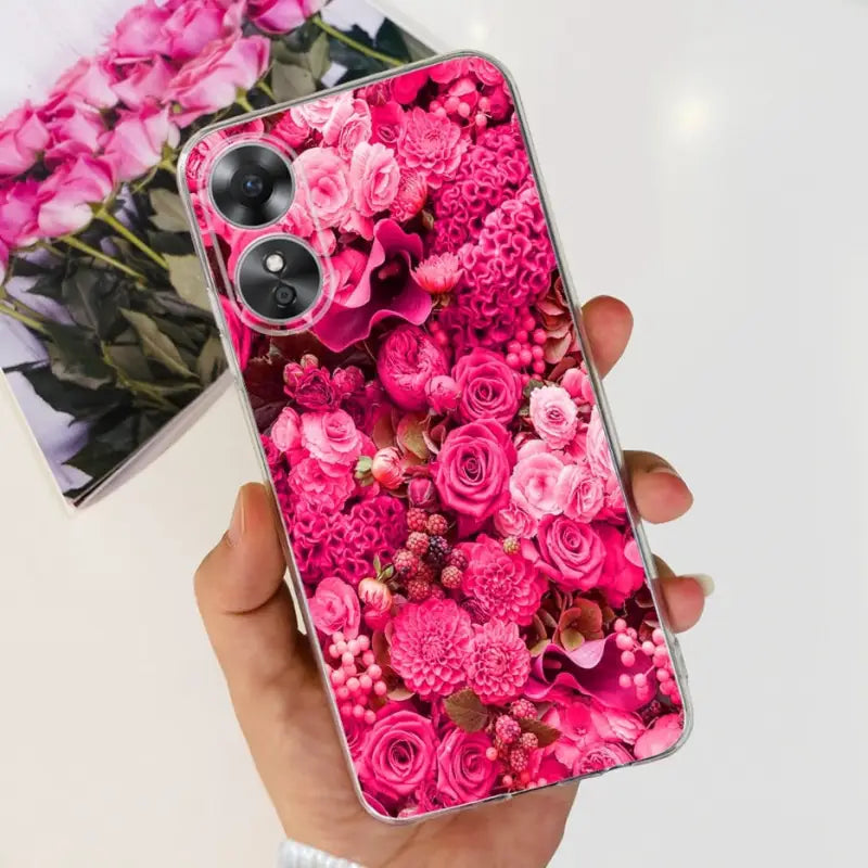a person holding a pink flower phone case
