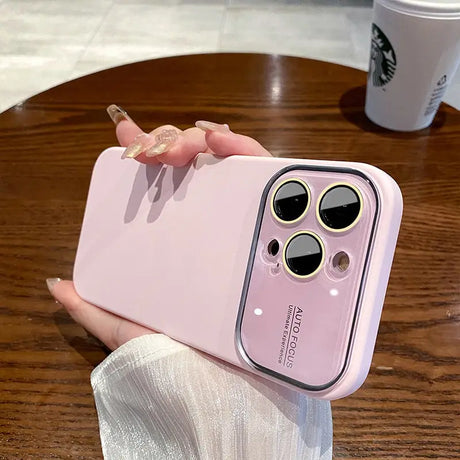 a person holding a pink iphone case