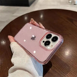 a person holding a pink iphone case