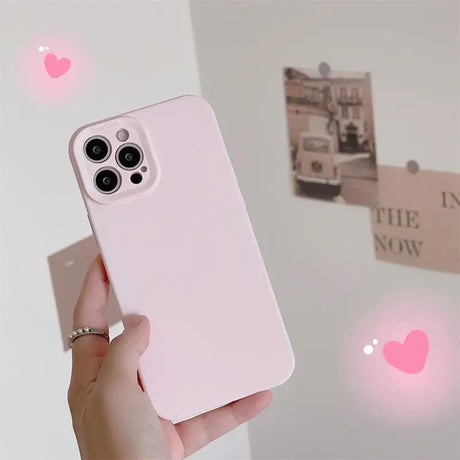 a person holding a pink iphone case