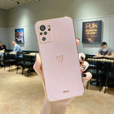 a person holding up a pink iphone case