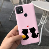 a person holding a pink phone case with a black cat and a heart