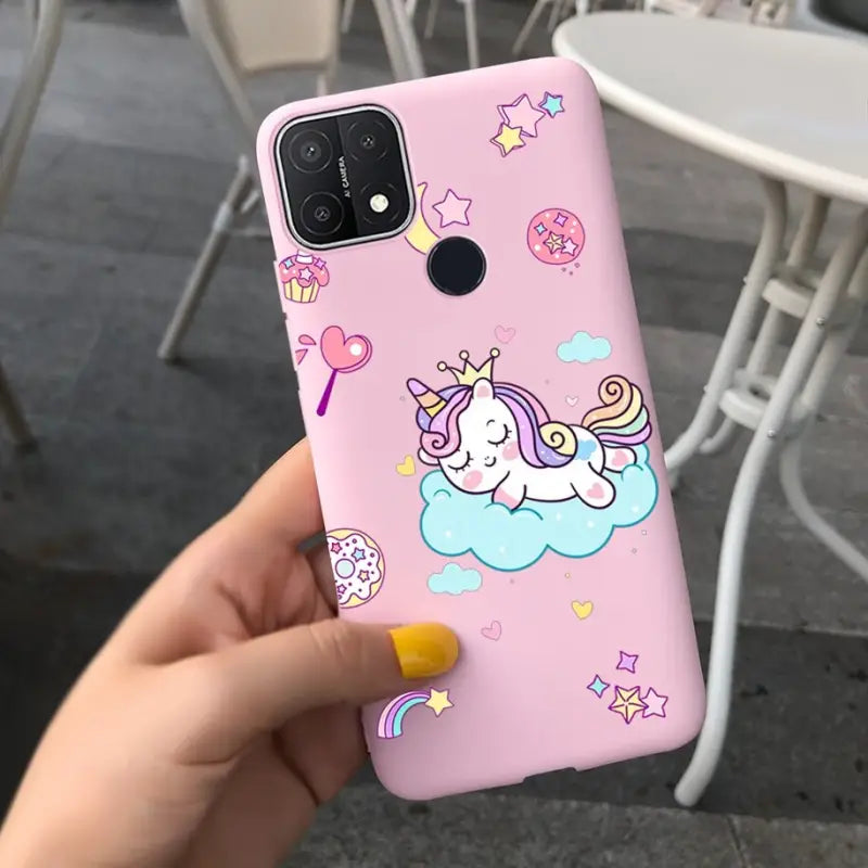 a pink phone case with a unicorn on it