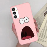 a person holding a pink phone case with a cartoon face