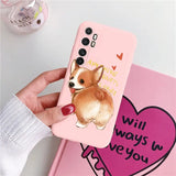 someone holding a pink phone case with a corgi on it
