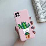 a person holding a pink phone case with a cactus on it