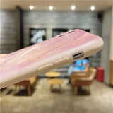 a pink iphone case with a pink liquid on it