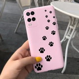 a person holding a pink phone case with paw prints