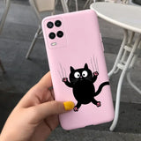 a person holding a pink phone case with a black cat on it