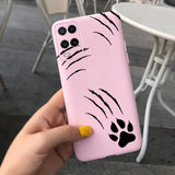 a person holding a pink phone case with a black cat face on it