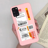 a person holding a pink phone case with a barcode sticker on it