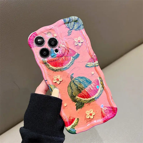 a person holding a pink phone case