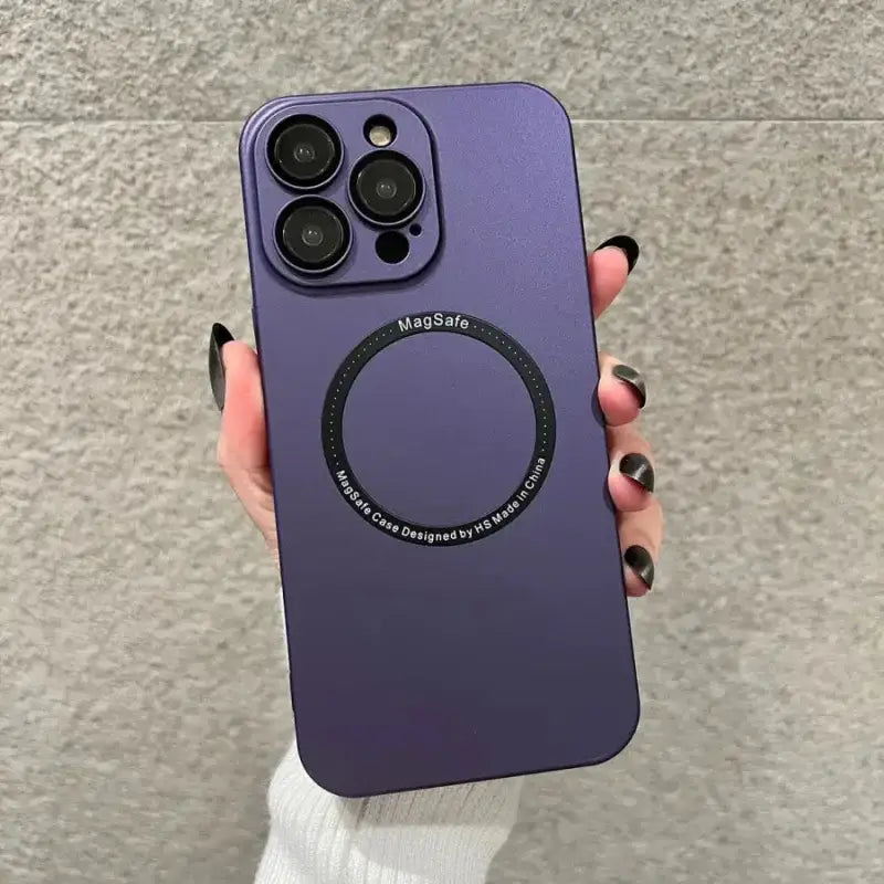 a person holding a purple iphone case