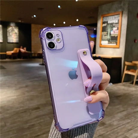 a person holding a purple iphone case