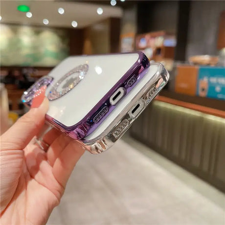 a woman holding a purple iphone case