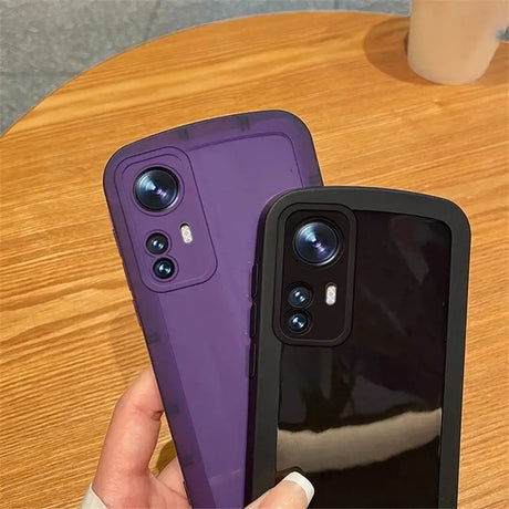 a person holding a purple iphone case