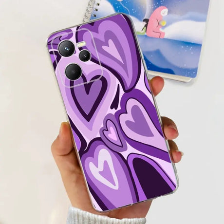 a person holding a purple phone case