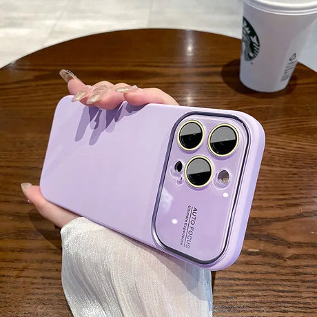 a person holding a purple phone case