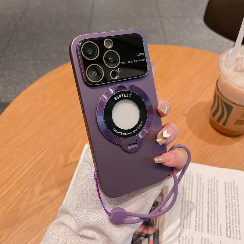a woman holding a purple phone case with a camera attached to it
