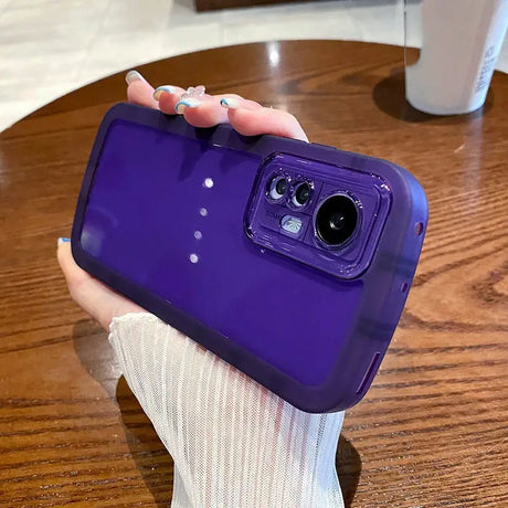 a person holding a purple phone case