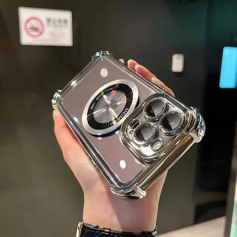 a person holding a silver camera