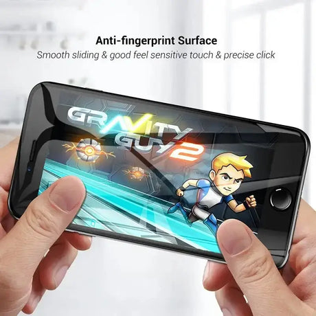 a person holding a smartphone with a game on it