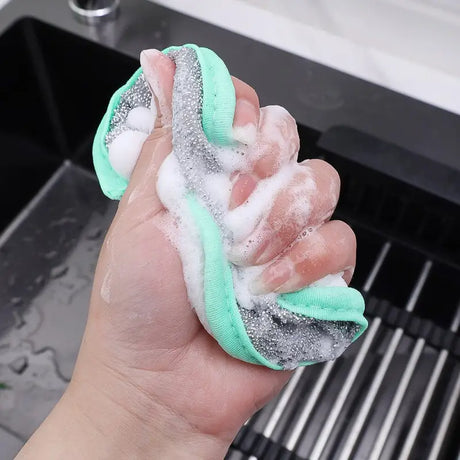 a person holding a sponge sponge on their hand