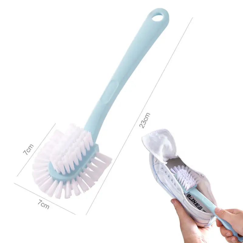 a hand holding a tooth brush and toothbrush