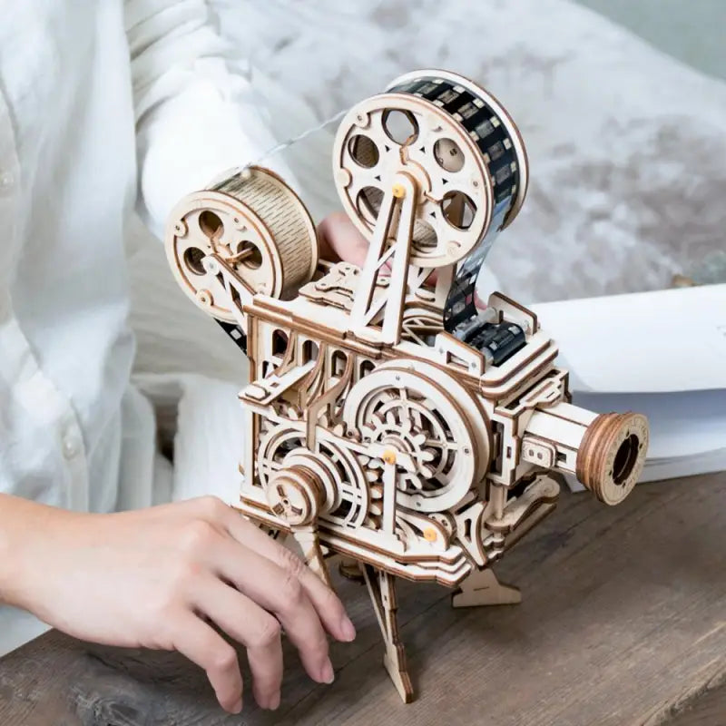 a person is working on a wooden model