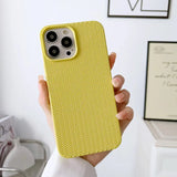 a person holding a yellow iphone case