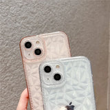 a person holding an iphone case with a diamond pattern