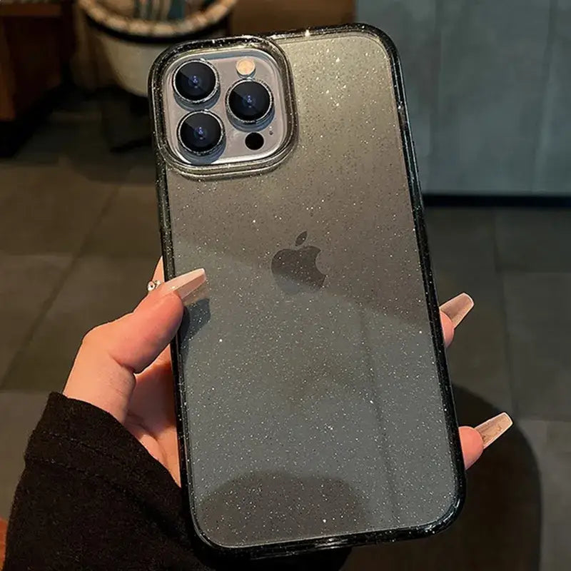 a person holding an iphone case with glitter on it