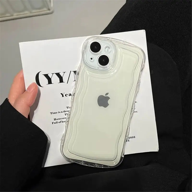 a person holding an iphone case in their hand