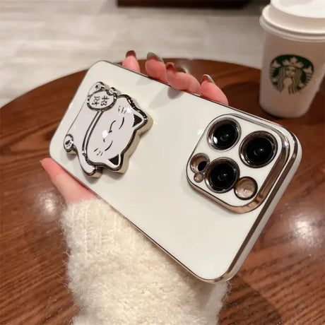 A person holding an iphone case with a panda face on it