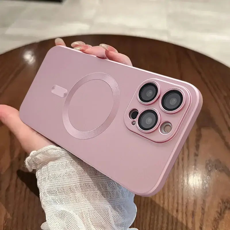 a person holding an iphone with a pink case