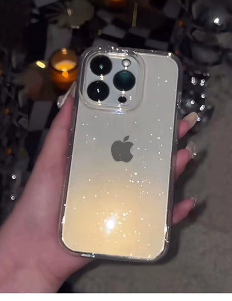 a person holding an iphone with a white light on it