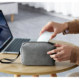 a person using a laptop and a cell case