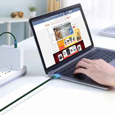 a person using a laptop on a desk