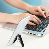 a woman using a laptop on a desk