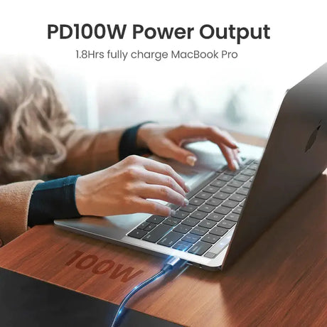 A person typing on a laptop with the text pdow power output