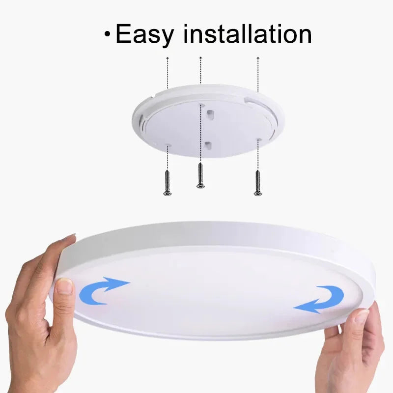a person holding a ceiling light with the words easy installation