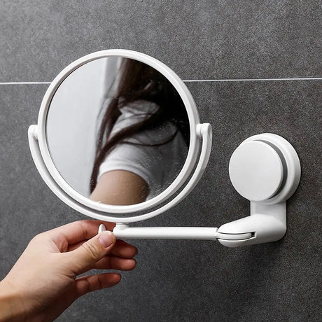 a person holding a mirror in their hand