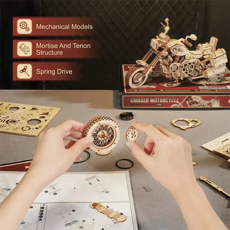 a person is working on a model of a motorcycle