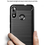 a person holding a motorola phone with a finger on it