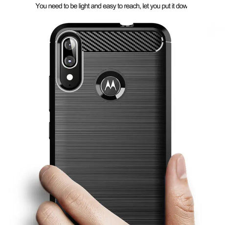 A person holding a motorola phone with a finger on it