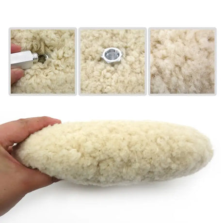 a hand is holding a piece of wool