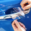 a person opening a door with a plastic handle