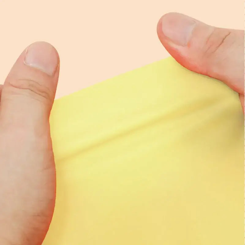 a person cutting paper with a knife