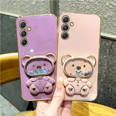 a person holding a phone case with a bear